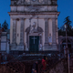 People walk in front of the heavily damaged church of Maria Santissima in Fleri, Sicily Italy, Wednesday, Dec. 26, 2018. A quake triggered by Italy's Mount Etna volcano has jolted eastern Sicily, slightly injuring 10 people and prompting frightened Italian villagers to flee their homes. (AP Photo/Salvatore Allegra)